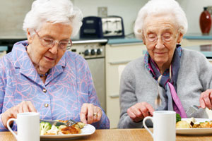 seniors sharing a meal